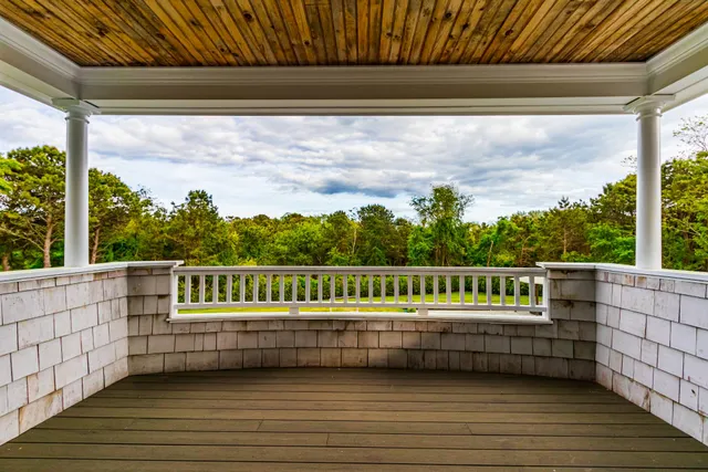 a white bath tub sitting in a bathroom next to a toilet