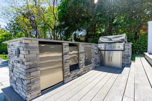 front view of a house with a sink and glass door