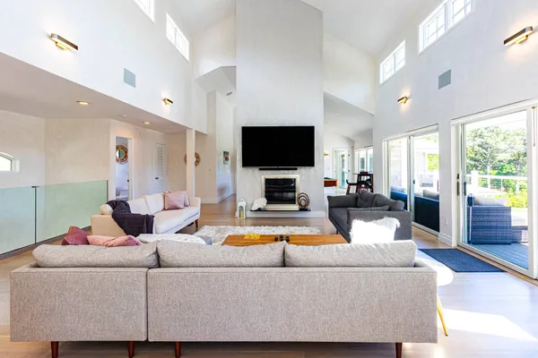 a living room with fireplace furniture and a flat screen tv
