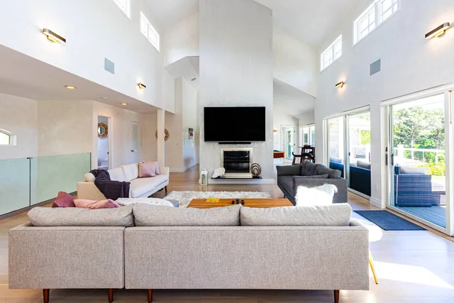 a living room with fireplace furniture and a flat screen tv