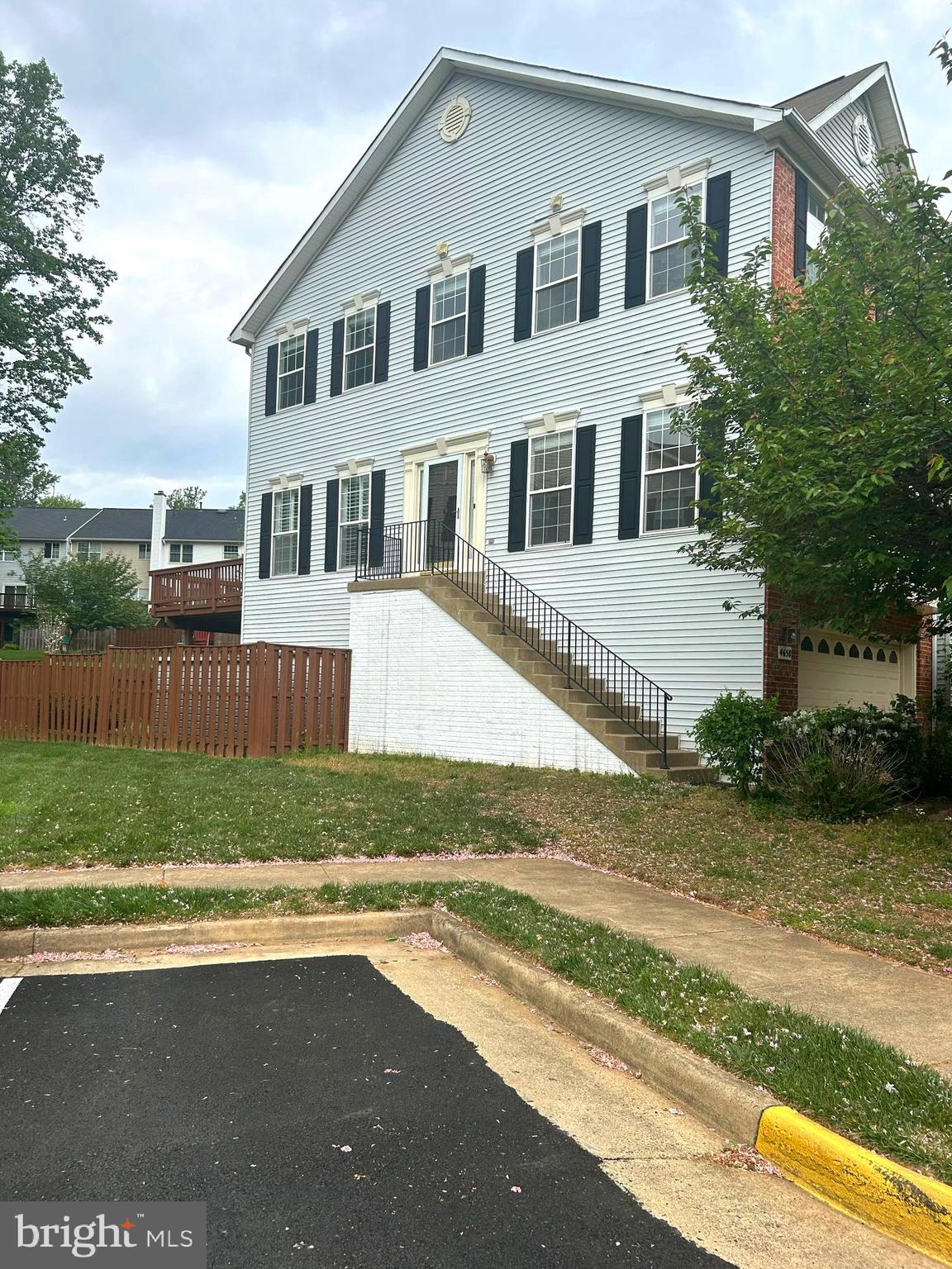 4658 Buckhorn Ridge Fairfax, VA 22030 - Photo 3 of 35 a front view of a house with a yard and garage