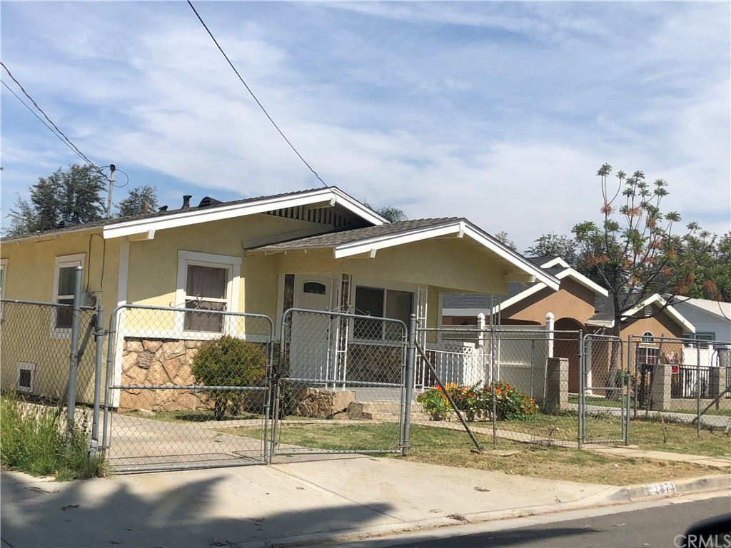 2873 Denton Street Riverside, CA 92507 - Photo 1 of 1 a front view of a house with garden