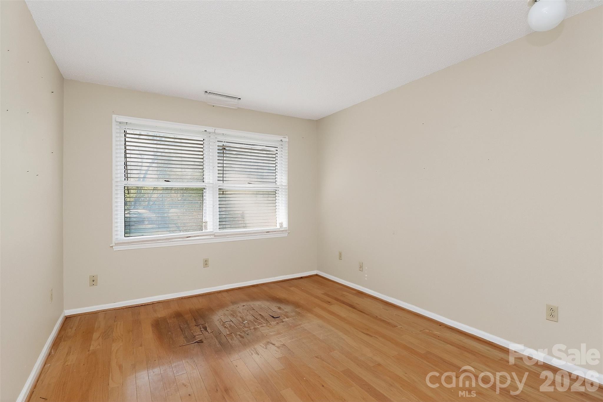 9516 Westmoreland Road Cornelius, NC 28031 - Photo 21 of 40 an empty room with a window