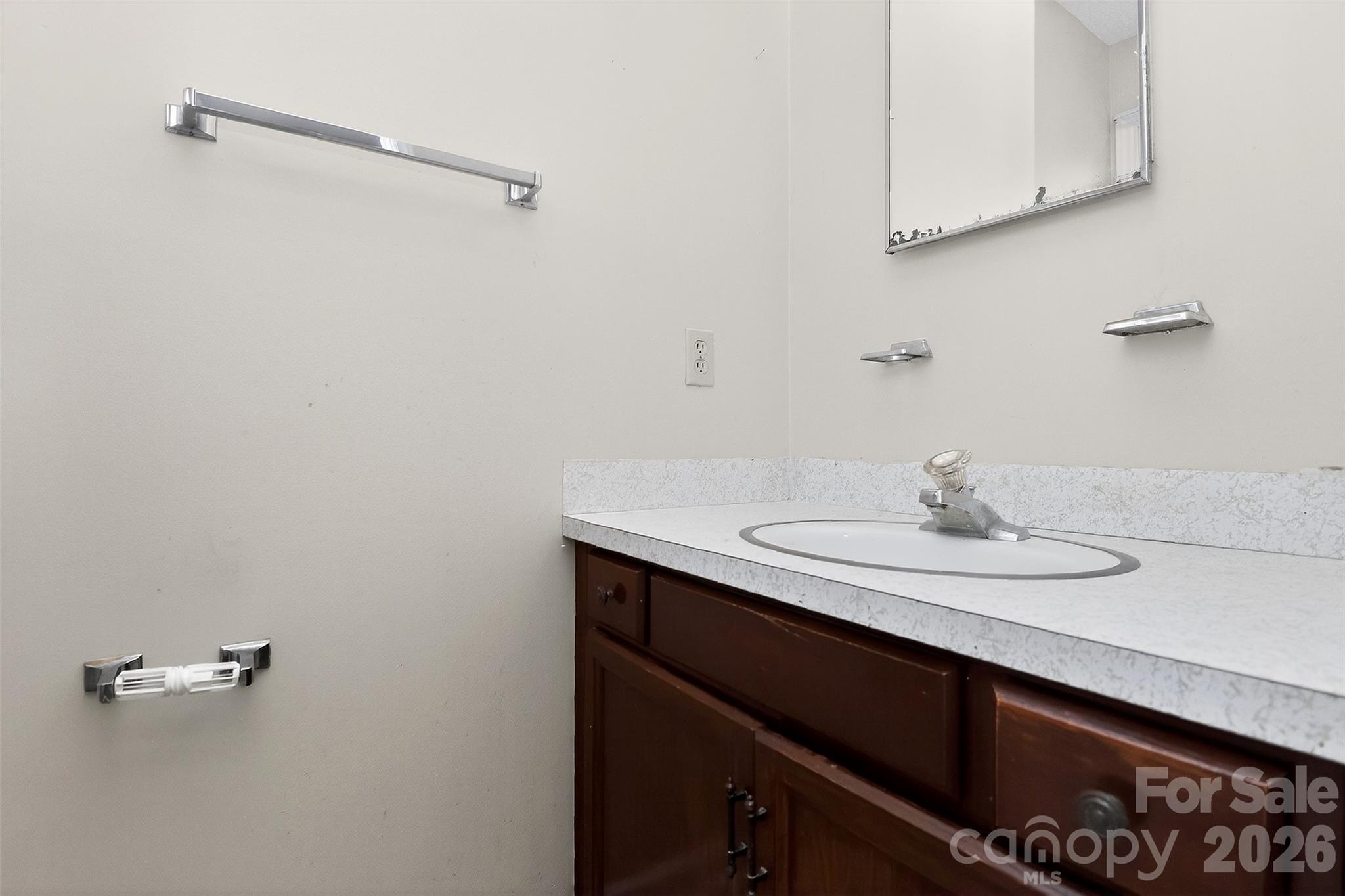 9516 Westmoreland Road Cornelius, NC 28031 - Photo 24 of 40 a bathroom with a sink and a mirror