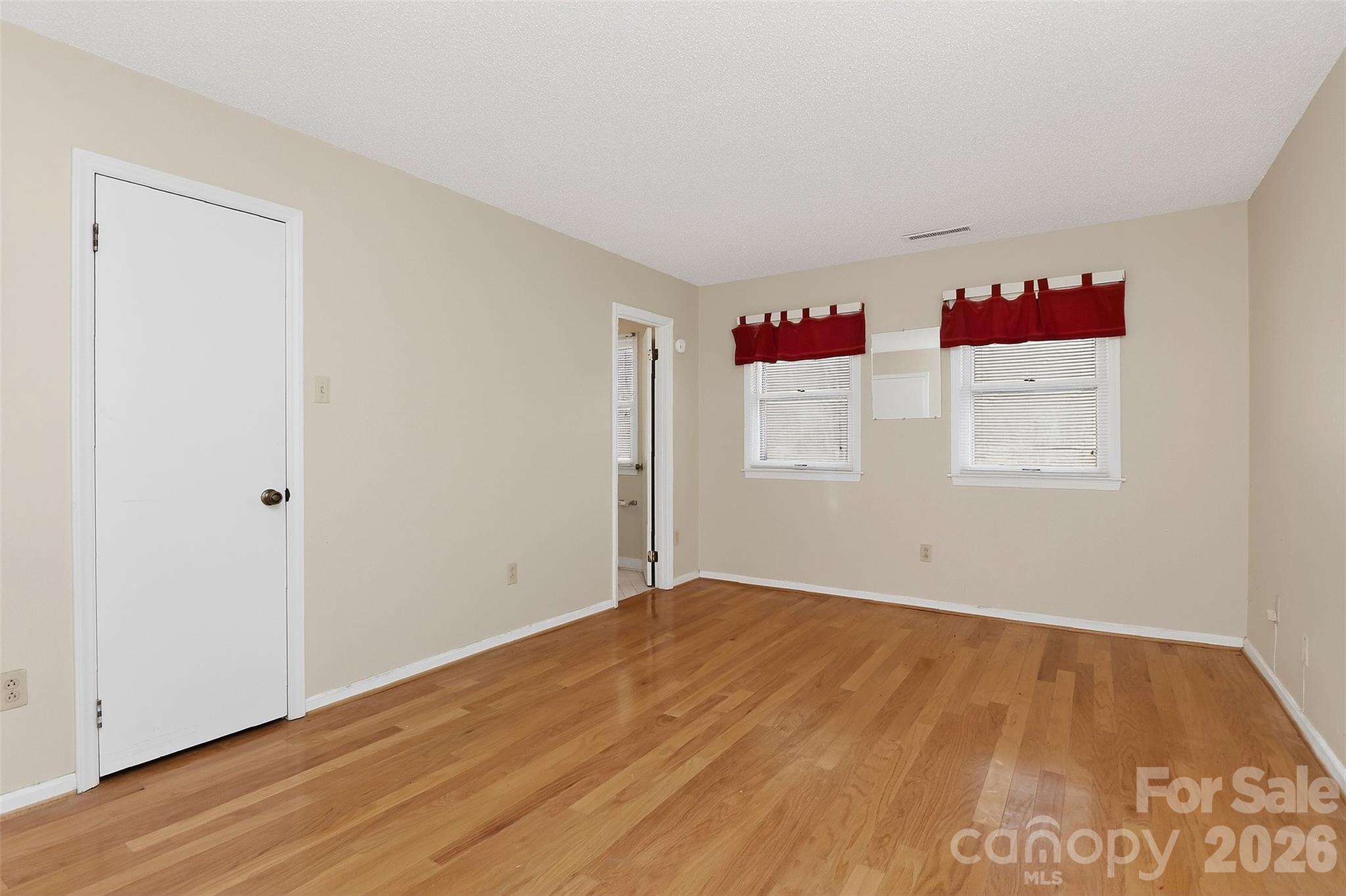 9516 Westmoreland Road Cornelius, NC 28031 - Photo 28 of 40 a view of a room with wooden floor and cabinet