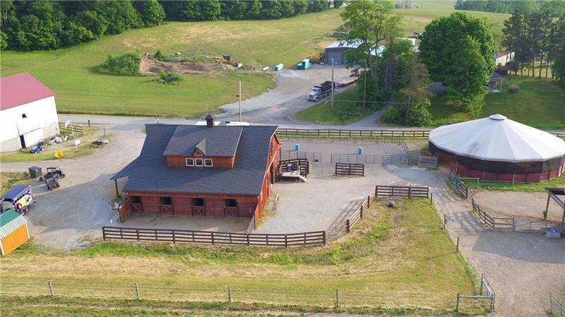 24 Stom Road Ligonier, PA 15658 - Photo 18 of 37 an aerial view of a house with swimming pool patio and lake view