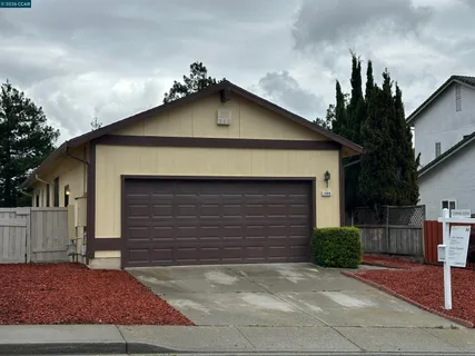 a front view of a house with garage