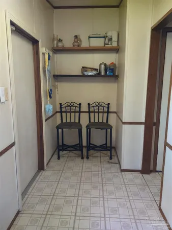 a view of a room with rack and shelf