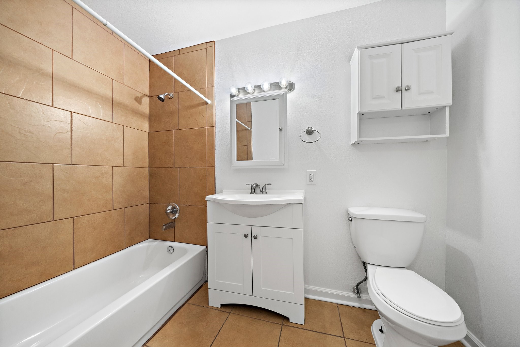 100 Market Street, Unit 55 Galveston, TX 77550 - Photo 9 of 9 a bathroom with a sink a toilet and bathtub