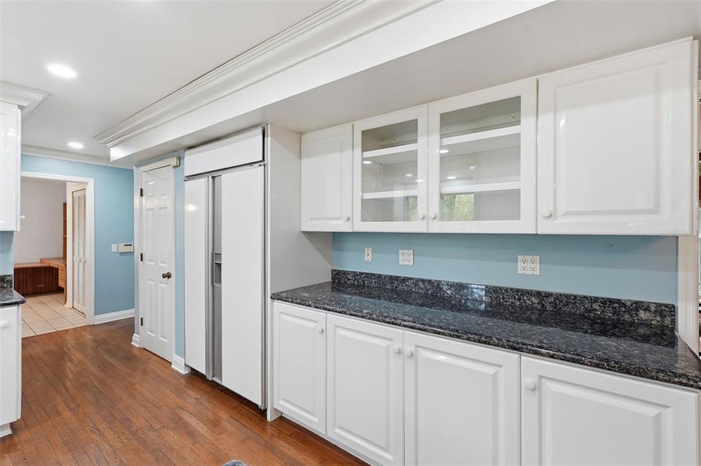 1840 Salem Court Dunedin, FL 34698 - Photo 18 of 64 a kitchen with stainless steel appliances granite countertop a refrigerator and cabinets