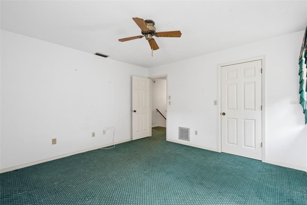 1840 Salem Court Dunedin, FL 34698 - Photo 32 of 64 an empty room with ceiling fan and window