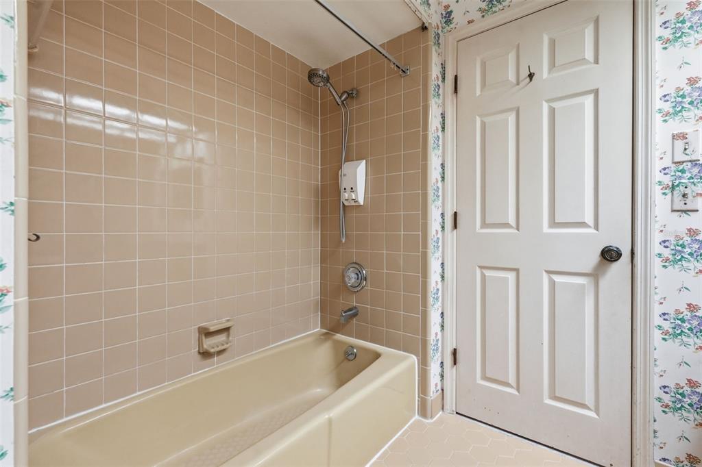 1840 Salem Court Dunedin, FL 34698 - Photo 34 of 64 a bathroom with a bathtub and a shower