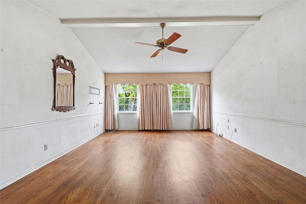 1840 Salem Court Dunedin, FL 34698 - Photo 38 of 64 a view of a livingroom with wooden floor and a window