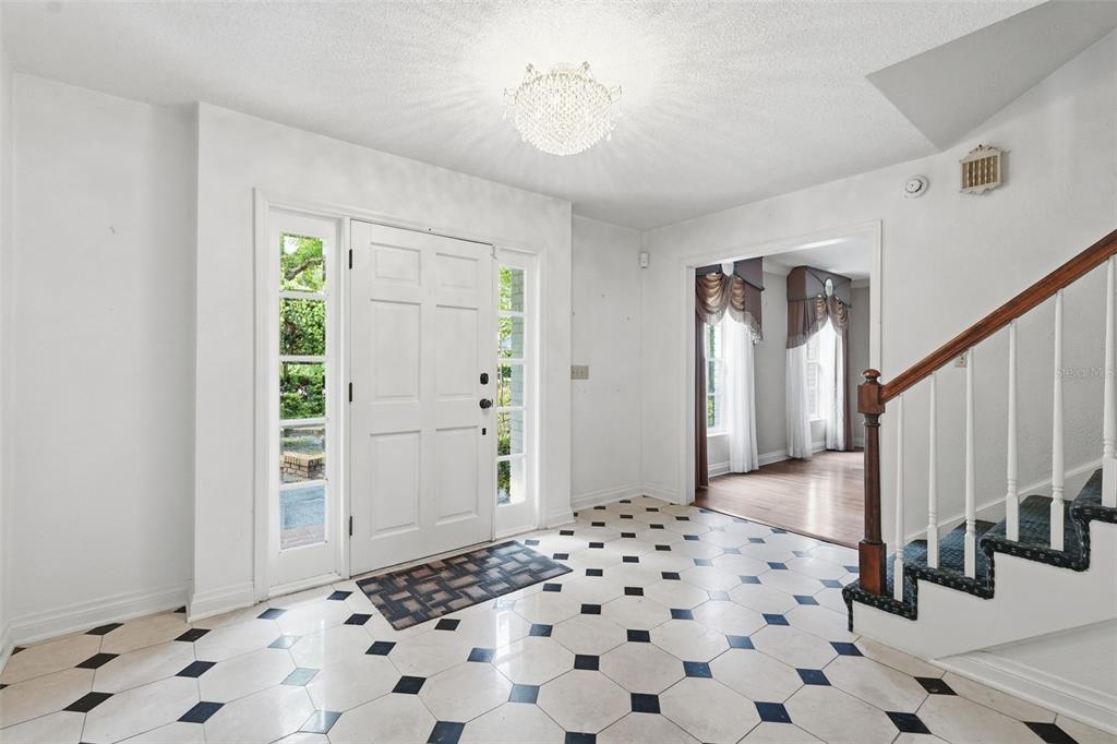1840 Salem Court Dunedin, FL 34698 - Photo 4 of 64 a view of a hallway with wooden floor and a bathroom