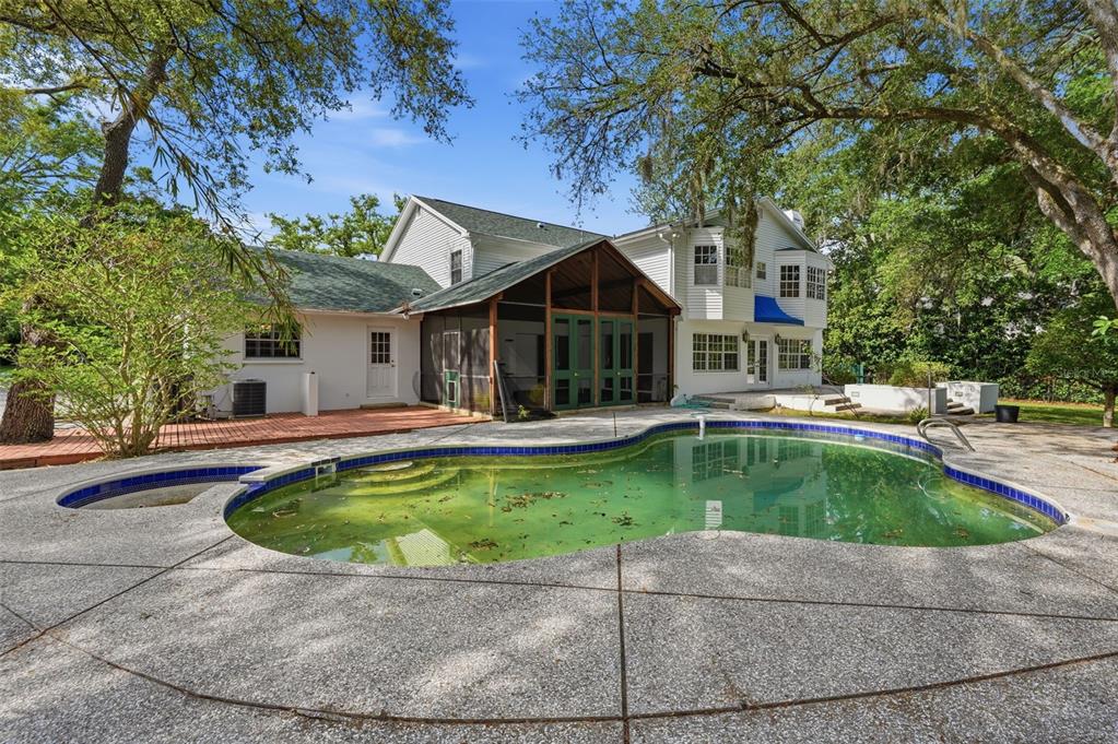 1840 Salem Court Dunedin, FL 34698 - Photo 57 of 64 a view of a house with swimming pool