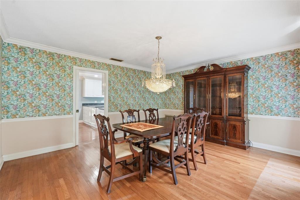 1840 Salem Court Dunedin, FL 34698 - Photo 8 of 64 a view of a dining room with furniture window and wooden floor