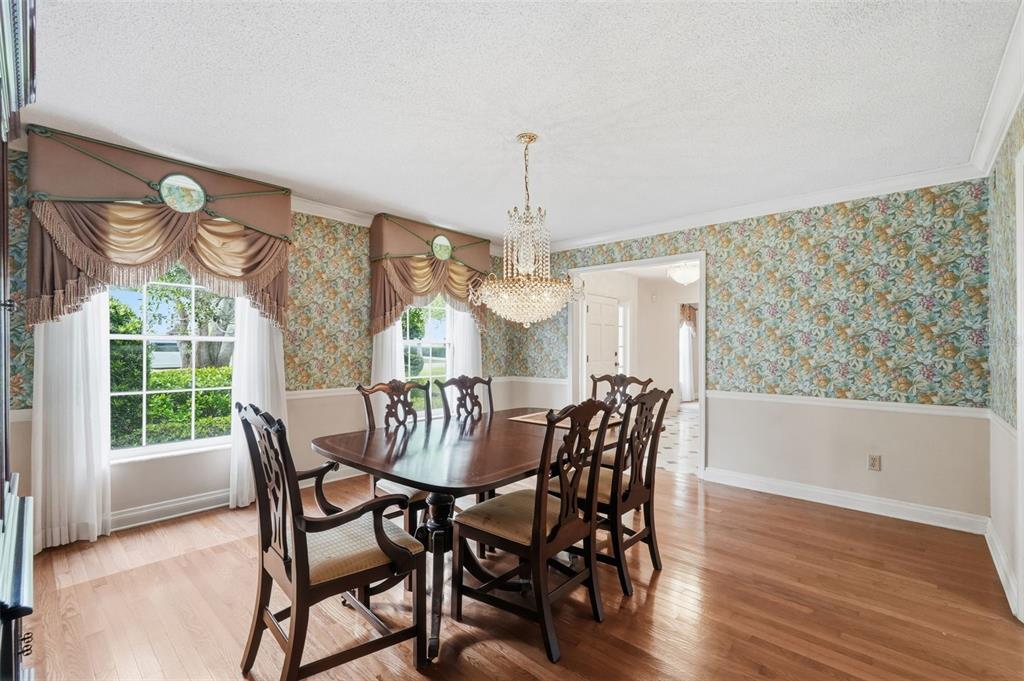 1840 Salem Court Dunedin, FL 34698 - Photo 9 of 64 a view of a dining room with furniture window and wooden floor
