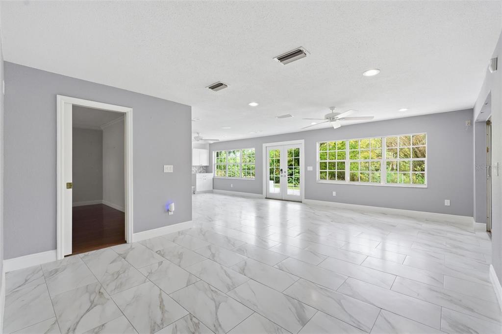 1840 Salem Court Dunedin, FL 34698 - Photo 10 of 64 a view of an empty room with a window