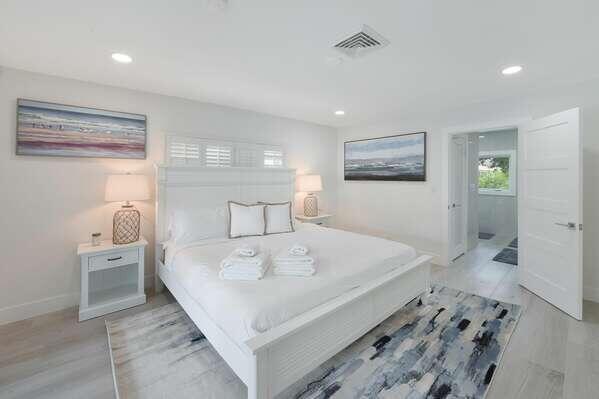 839 Enfield Street Boca Raton, FL 33487 - Photo 9 of 36 a spacious bedroom with a bed and a view of bathroom