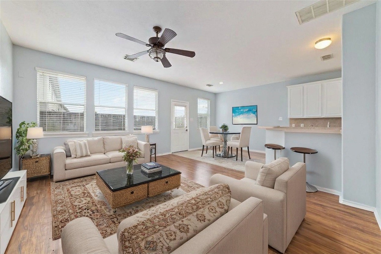 8734 Rainglen Lane Houston, TX 77044 - Photo 7 of 28 a living room with furniture and a large window