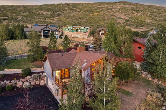 12465 Bone Road Kamas, UT 84036 - Photo 58 of 63 Multi-level residence featuring a brown shingle roof, light-toned siding, and a wood-finish deck