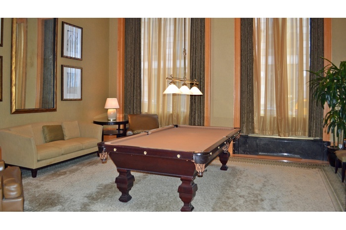 220 Riverside Boulevard, Unit 4D Manhattan, NY 10069 - Photo 12 of 14 a living room with furniture and a potted plant