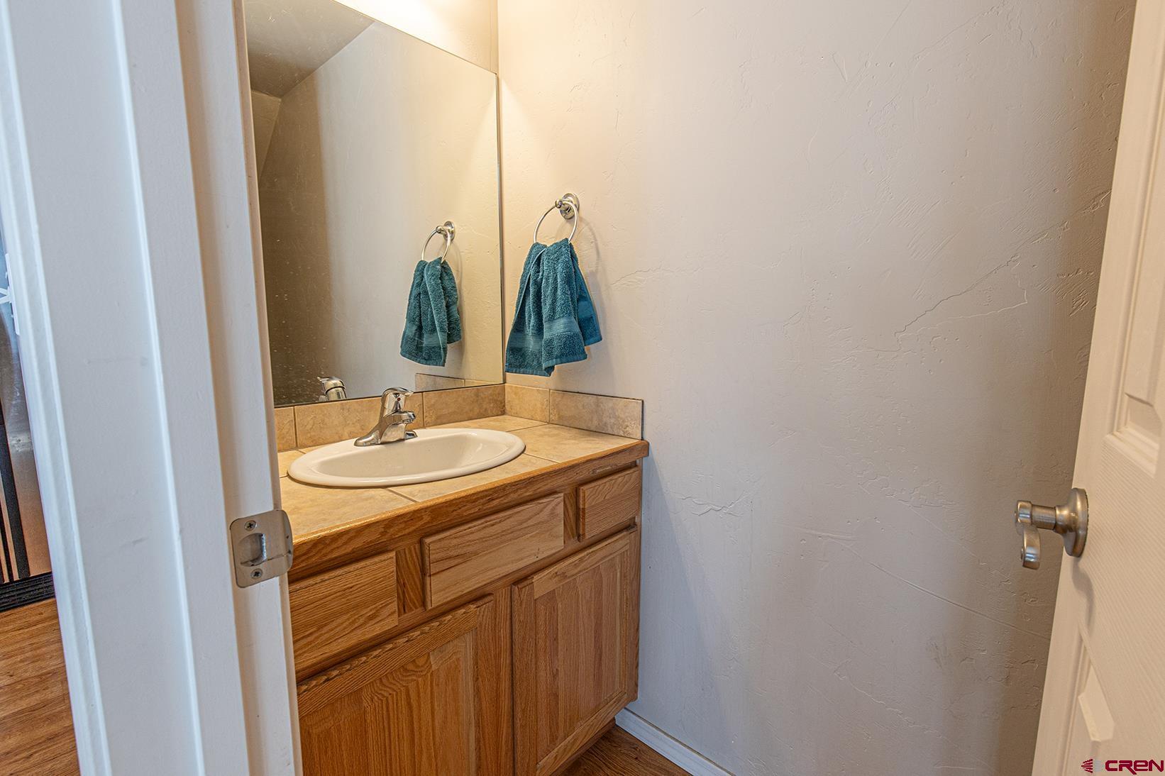 325 Star Crossing, Unit 2 Bayfield, CO 81122 - Photo 11 of 24 a bathroom with a sink and mirror