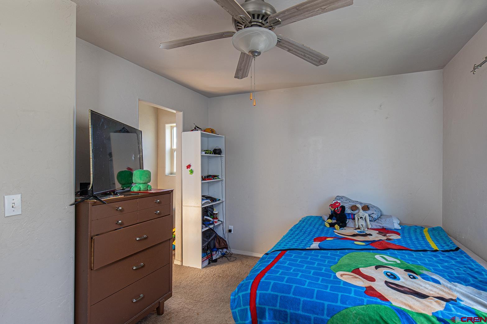325 Star Crossing, Unit 2 Bayfield, CO 81122 - Photo 19 of 24 a kids room with toys and dresser