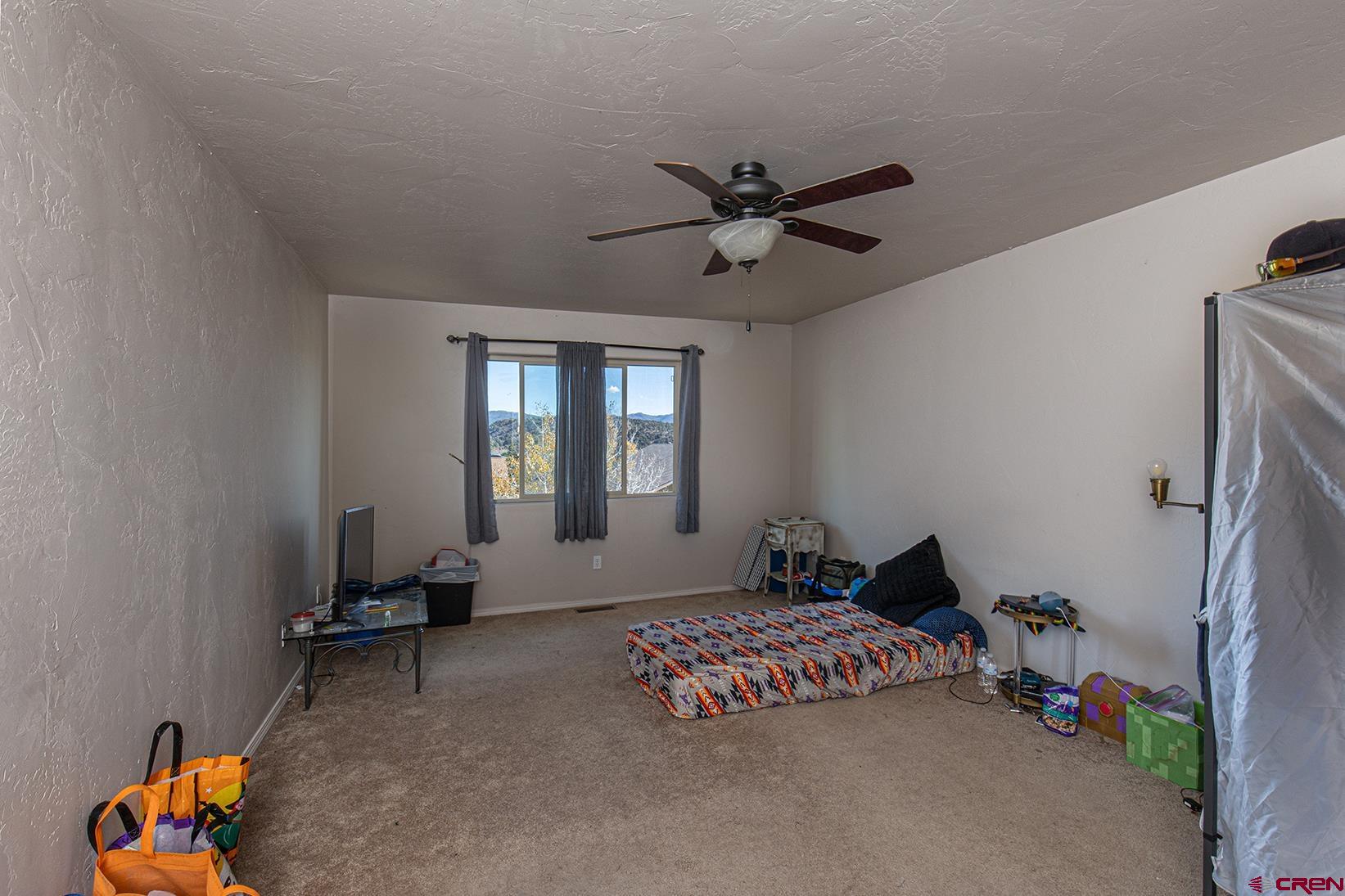 325 Star Crossing, Unit 2 Bayfield, CO 81122 - Photo 20 of 24 a bedroom with a bed and a window