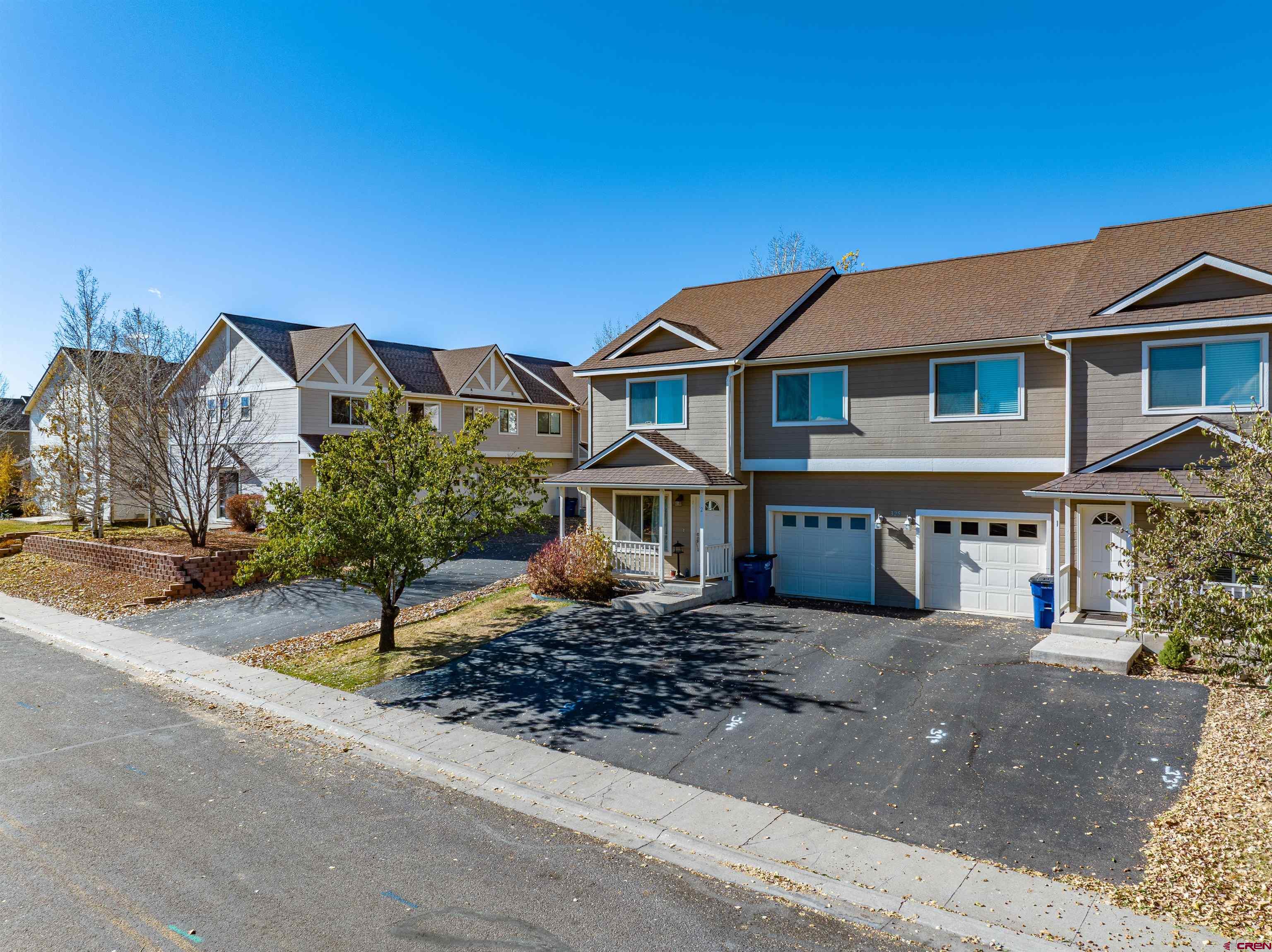 325 Star Crossing, Unit 2 Bayfield, CO 81122 - Photo 2 of 24 a front view of a house with a yard