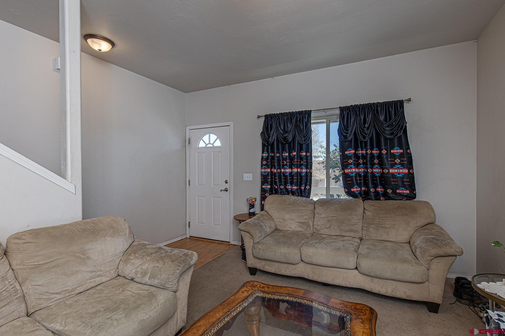 325 Star Crossing, Unit 2 Bayfield, CO 81122 - Photo 5 of 24 a living room with furniture and a window