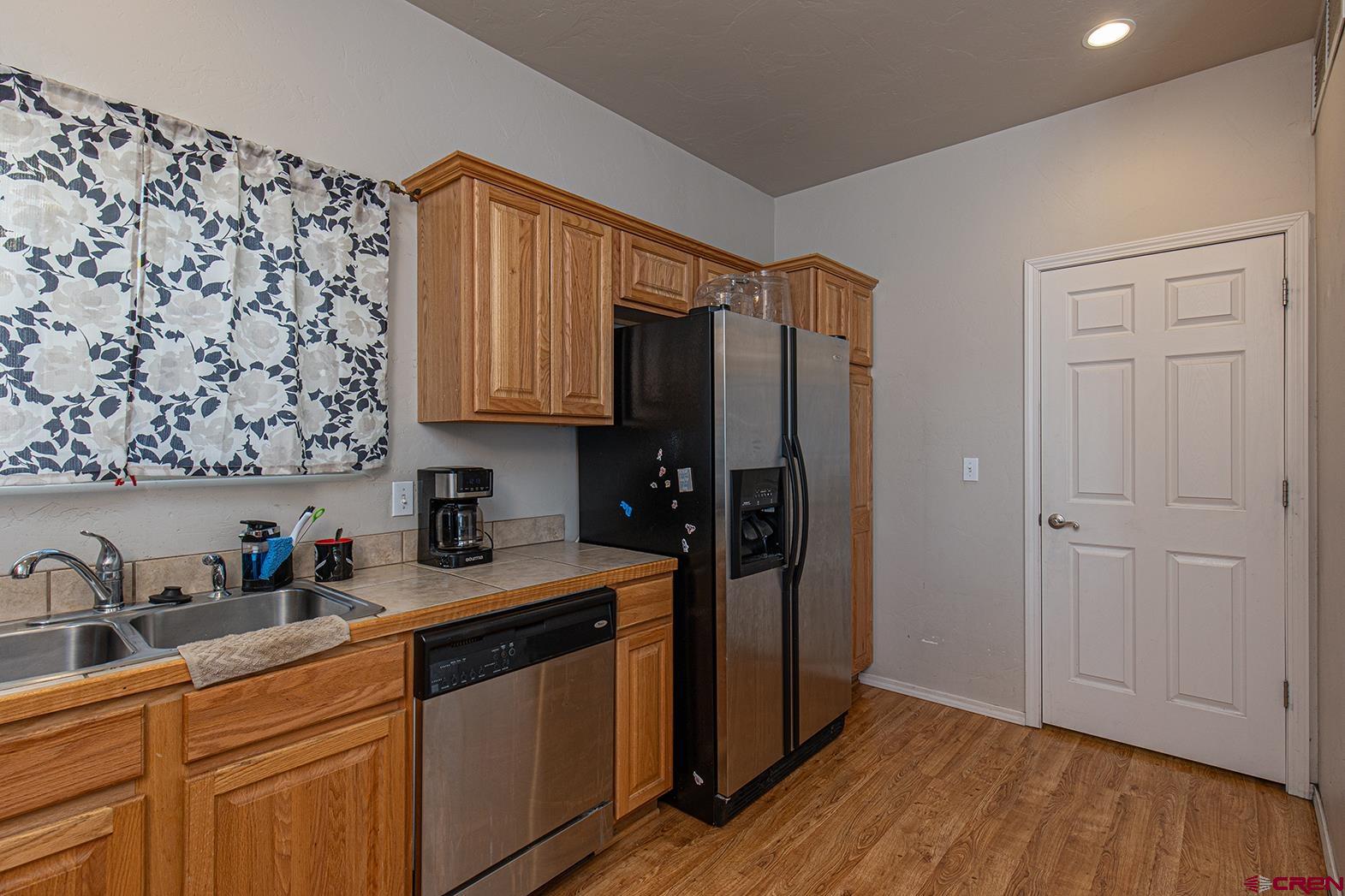 325 Star Crossing, Unit 2 Bayfield, CO 81122 - Photo 9 of 24 a kitchen with stainless steel appliances a refrigerator and cabinets