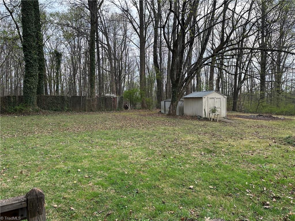 174 Sunset Drive Rural Hall, NC 27045 - Photo 18 of 18 back yard with storage bldg