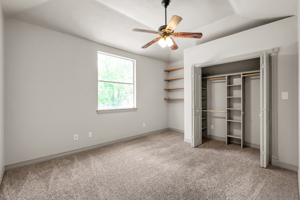 12758 Aries Loop Willis, TX 77318 - Photo 23 of 48 a view of a livingroom with a ceiling fan and window