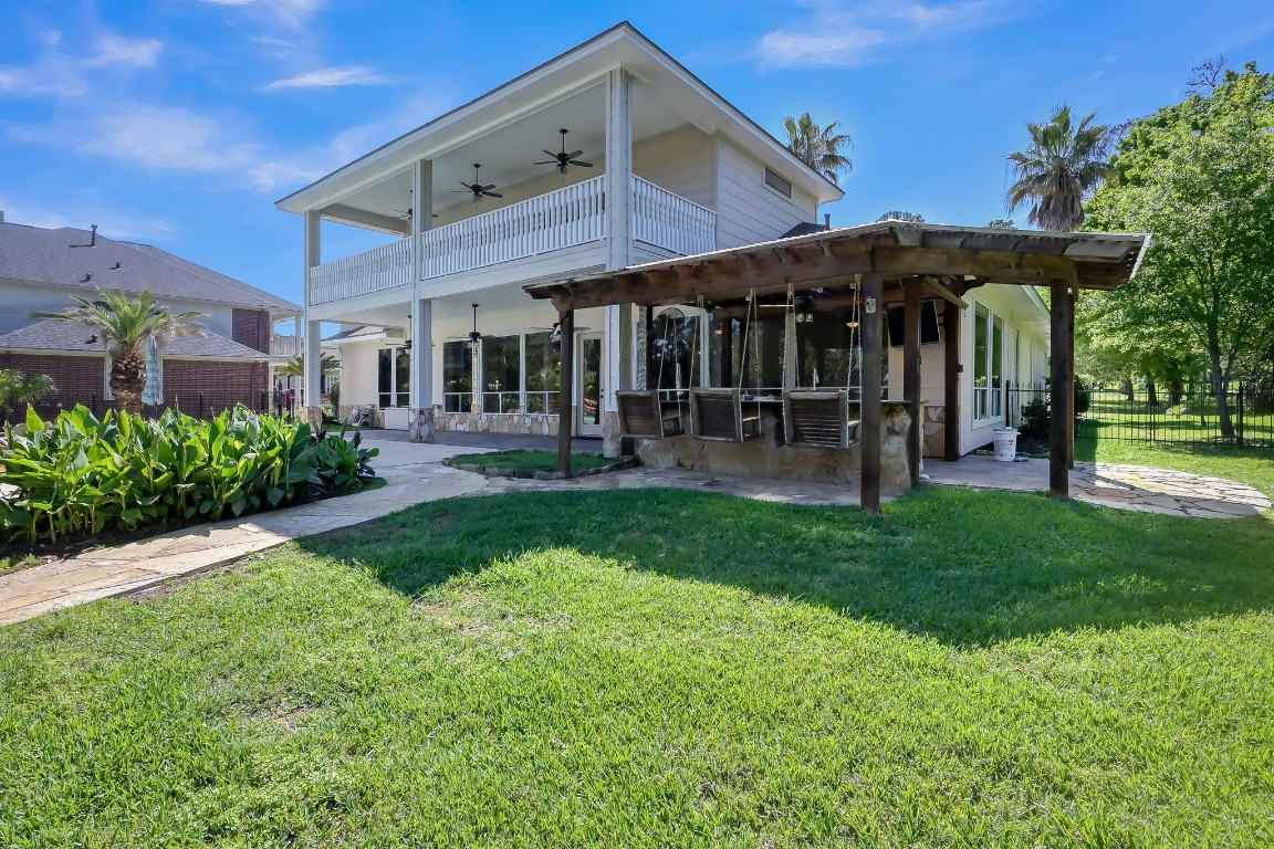 12758 Aries Loop Willis, TX 77318 - Photo 33 of 48 a front view of a house with garden and porch