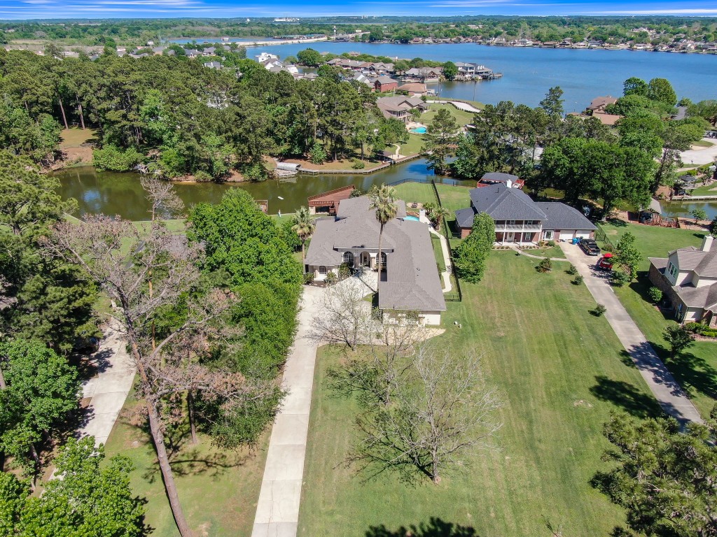 12758 Aries Loop Willis, TX 77318 - Photo 38 of 48 an aerial view of residential houses with outdoor space