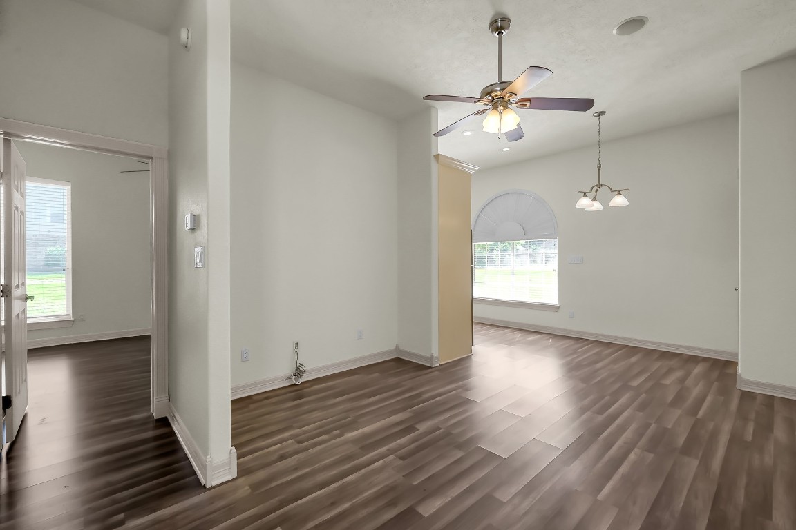 12758 Aries Loop Willis, TX 77318 - Photo 43 of 48 wooden floor in an empty room with a window