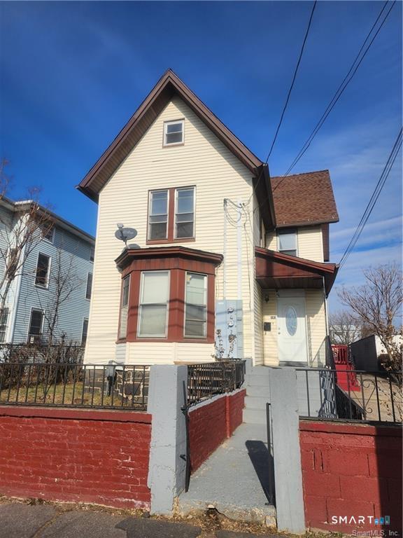 141 Hicks Street Bridgeport, CT 06608 - Photo 2 of 16 a view of a house with a street