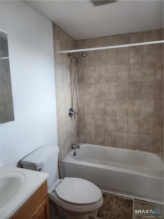 141 Hicks Street Bridgeport, CT 06608 - Photo 9 of 16 a bathroom with a toilet and a bath tub