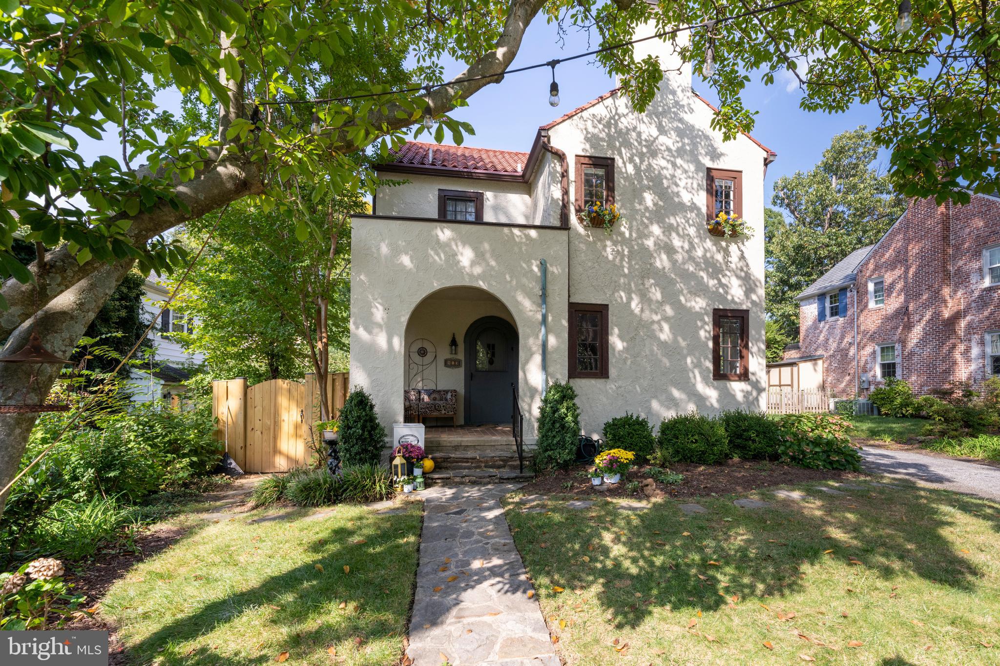 a front view of a house with yard