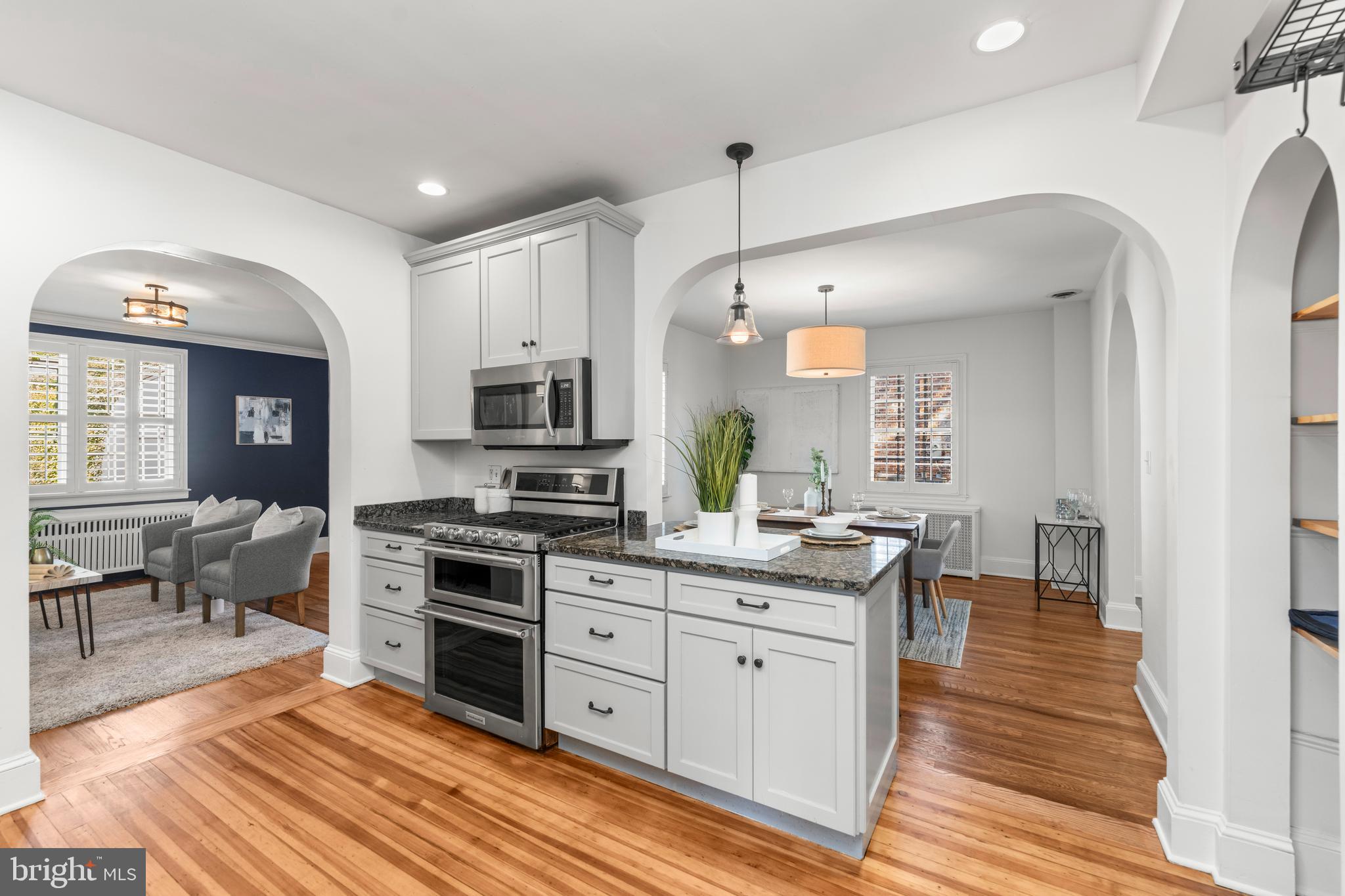 910 Kingston Road Baltimore, MD 21212 - Photo 8 of 36 a kitchen with stainless steel appliances kitchen island granite countertop a stove a sink and a refrigerator