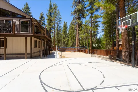 a view of a house with snow on the road