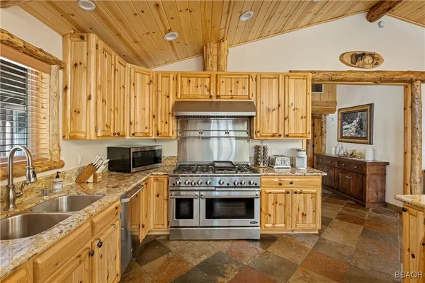 a kitchen with a stove and a refrigerator