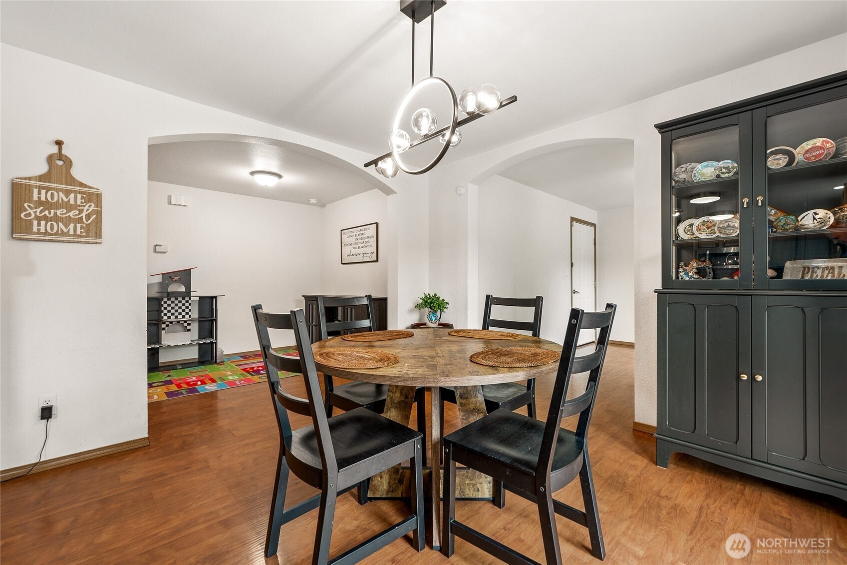 17535 Loop Lane Southeast Yelm, WA 98597 - Photo 11 of 30 a view of a dining room with furniture and wooden floor
