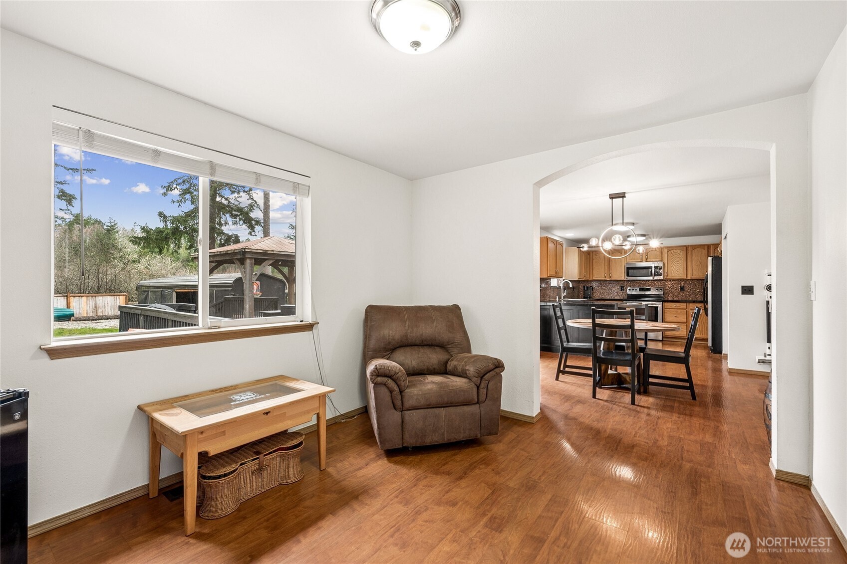 17535 Loop Lane Southeast Yelm, WA 98597 - Photo 17 of 30 a living room with furniture and a chandelier