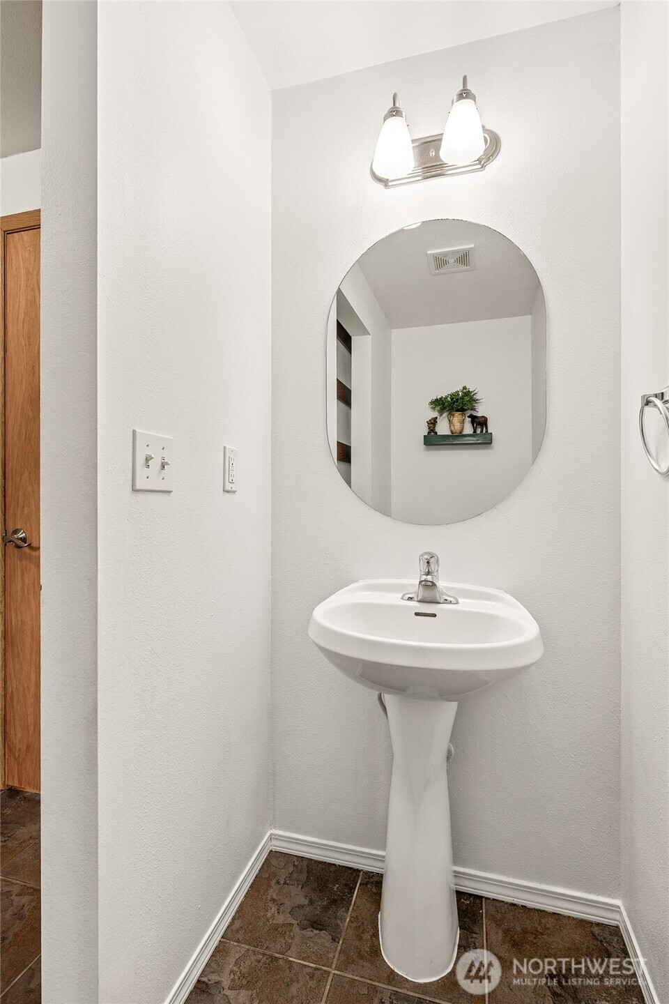 17535 Loop Lane Southeast Yelm, WA 98597 - Photo 19 of 30 a bathroom with a sink and mirror