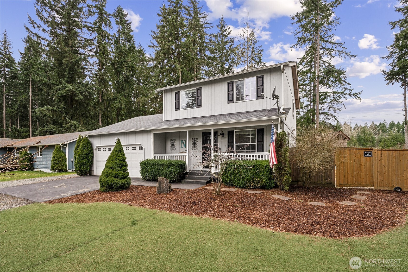 17535 Loop Lane Southeast Yelm, WA 98597 - Photo 2 of 30 a front view of a house with garden