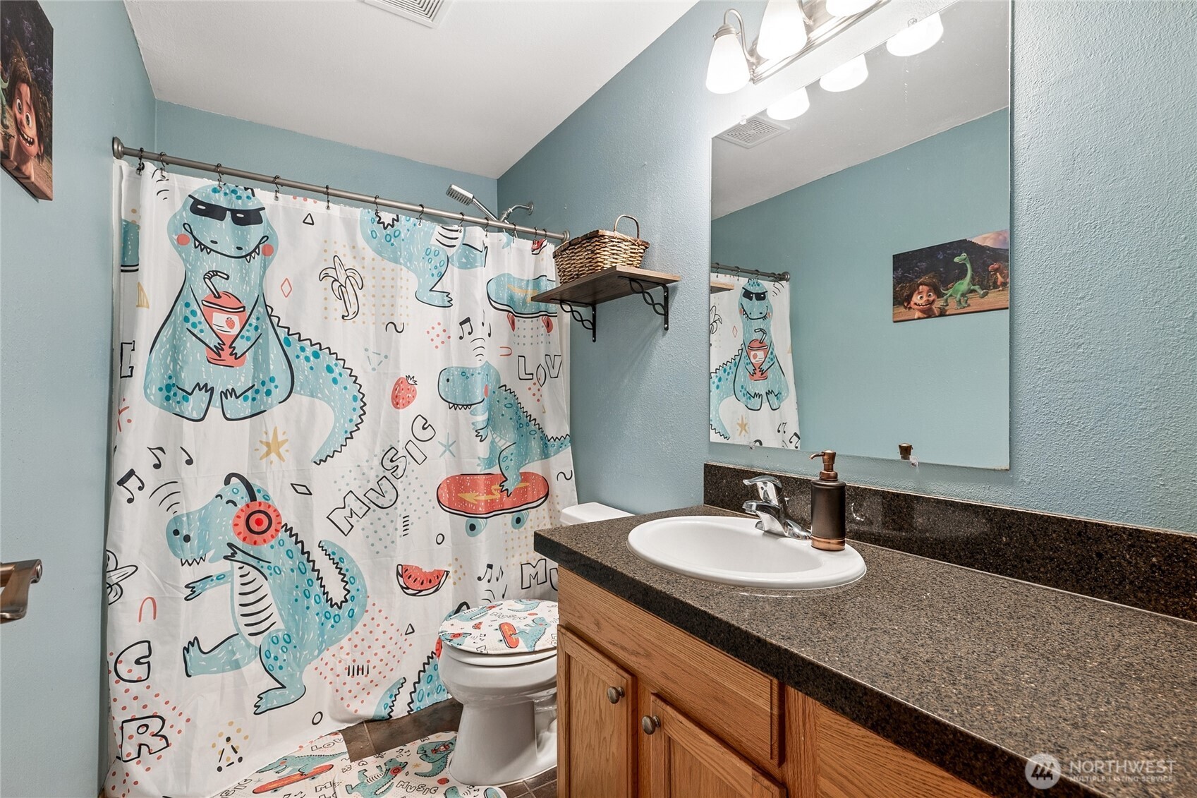 17535 Loop Lane Southeast Yelm, WA 98597 - Photo 21 of 30 a bathroom with a granite countertop sink and a mirror