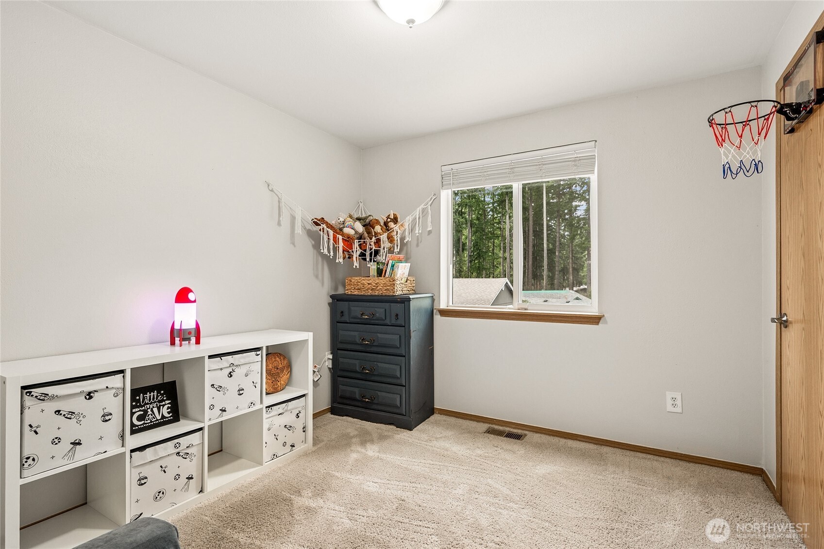 17535 Loop Lane Southeast Yelm, WA 98597 - Photo 22 of 30 a room with furniture a stove and a window