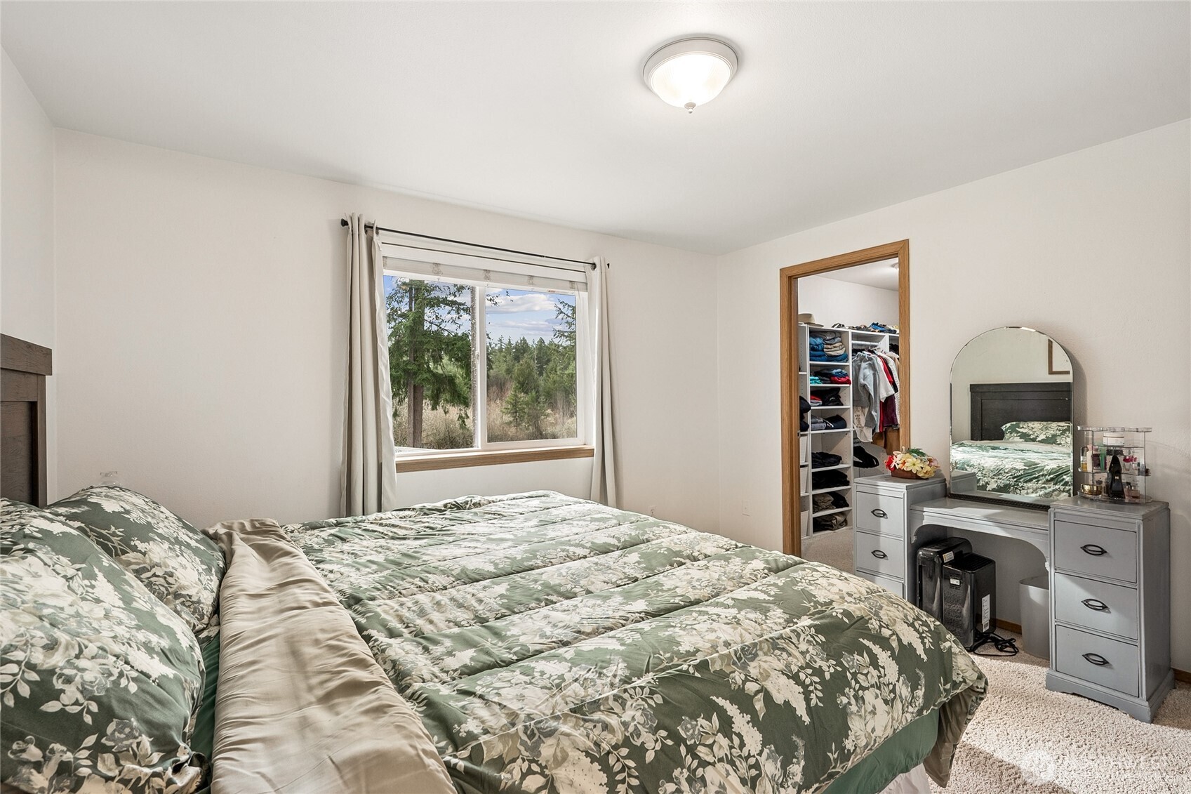 17535 Loop Lane Southeast Yelm, WA 98597 - Photo 23 of 30 a bedroom with a bed and a dresser